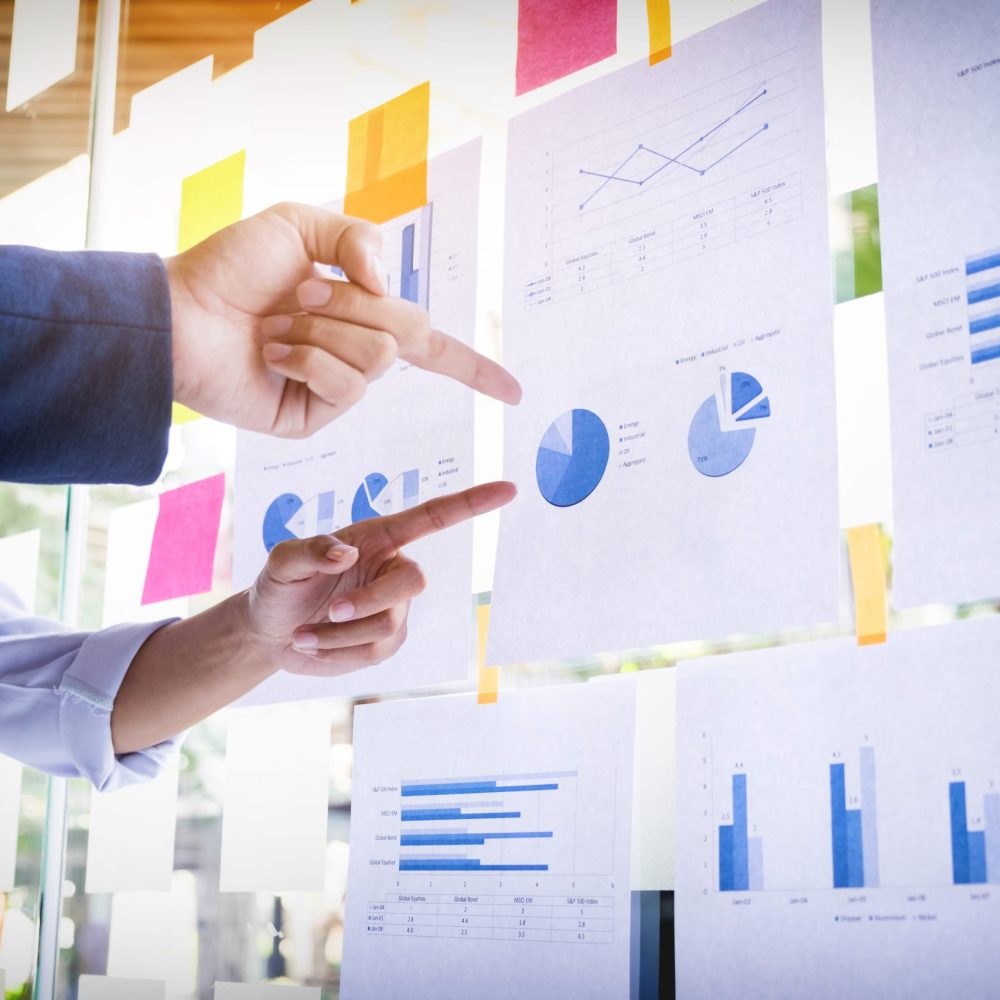 Businessman making presentation with his colleagues and business Businessman making presentation with his colleagues and business strategy digital layer effect at the office as concept.